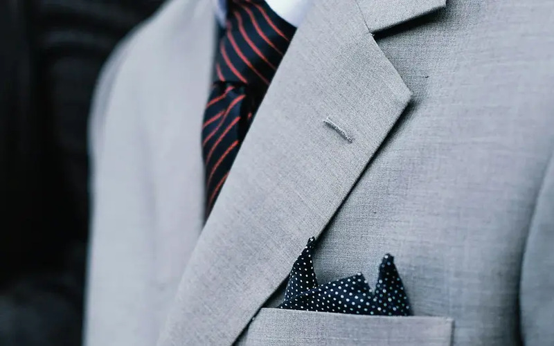A zoomed-in shot of a person wearing a stylish custom suit - build a successful custom suit business with Pearce Bespoke!