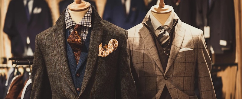 One single breasted and one double breasted suits on mannequins made by Pearce Bespoke. 