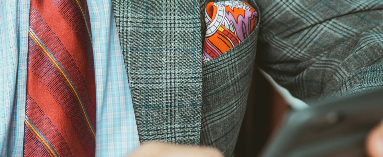 A closeup image of a suit pocket - create your perfect suit pocket today with Pearce Bespoke.