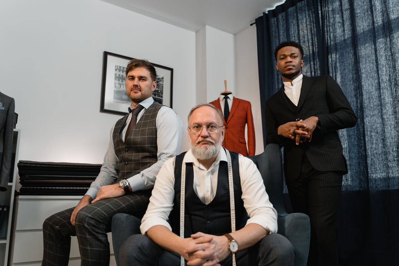 An image of three men working as custom tailors - learn everything you need to know about custom tailors with Pearce Bespoke.