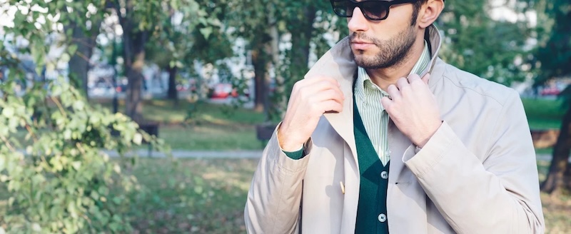 A man wearing a custom trench coat made by Pearce Bespoke.