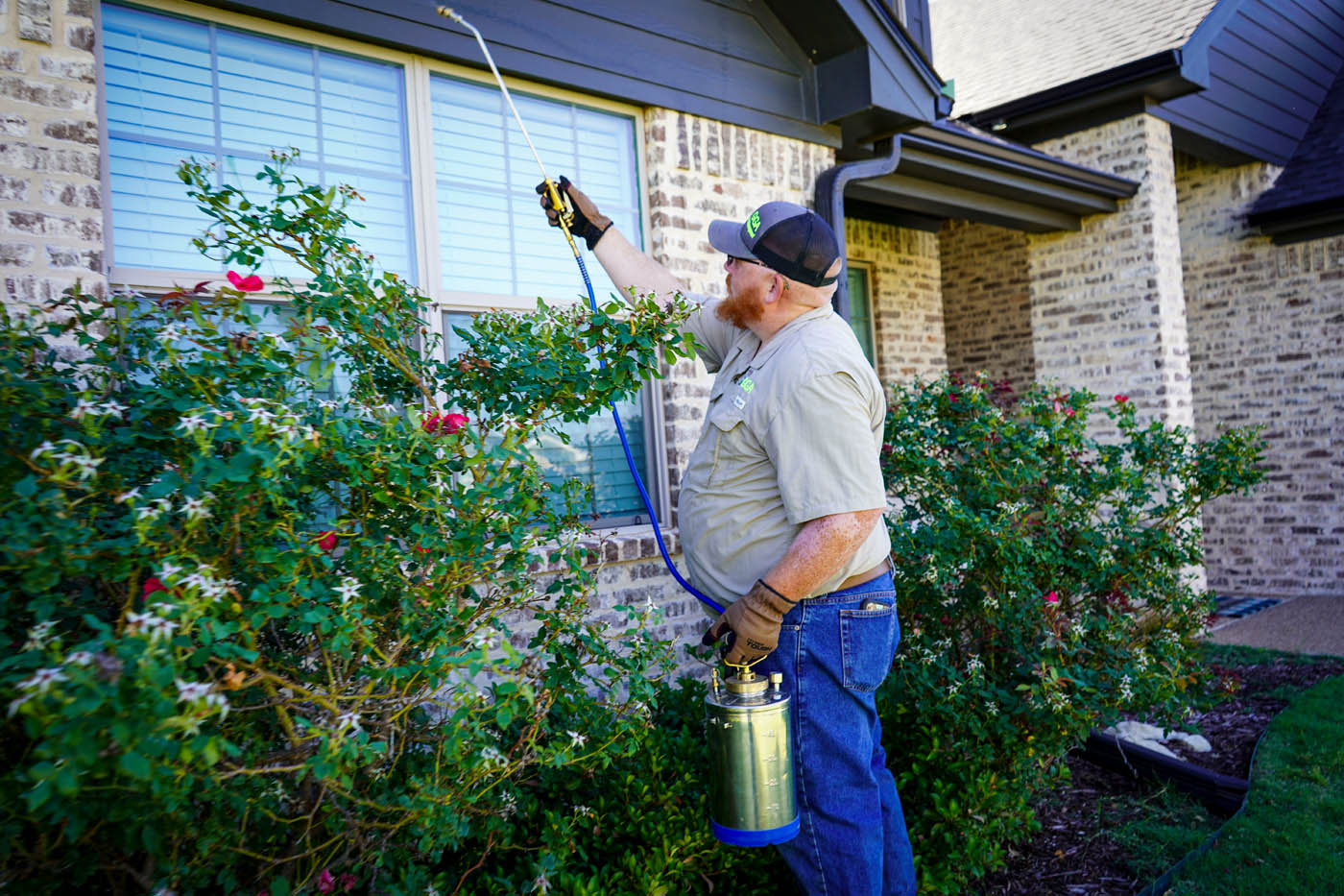 A GGA Pest Management technician working on a residential home.