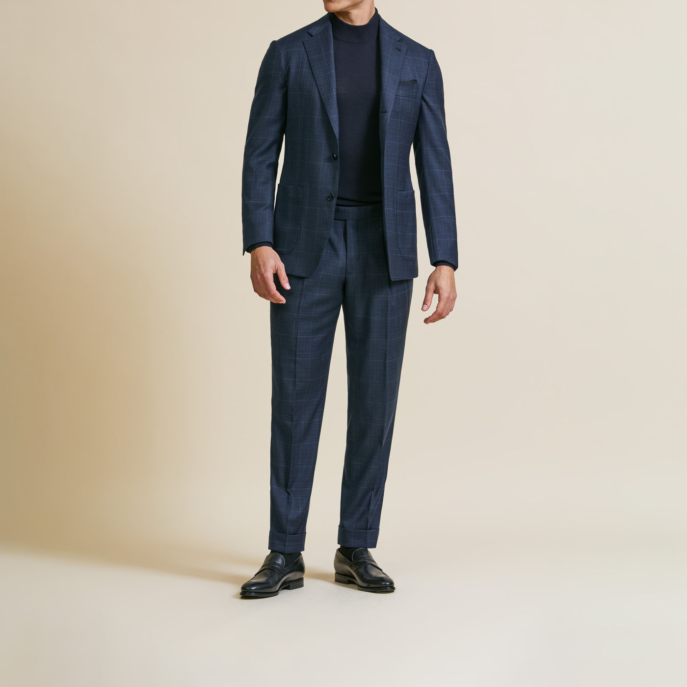 A Pearce Bespoke custom suit on a male model.