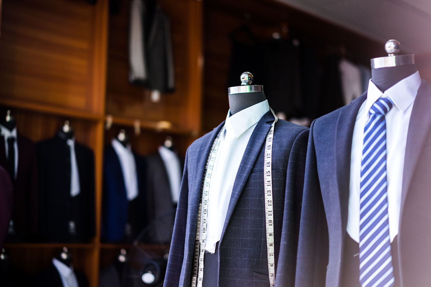 A picture of multiple Pearce Bespoke bespoke suits.