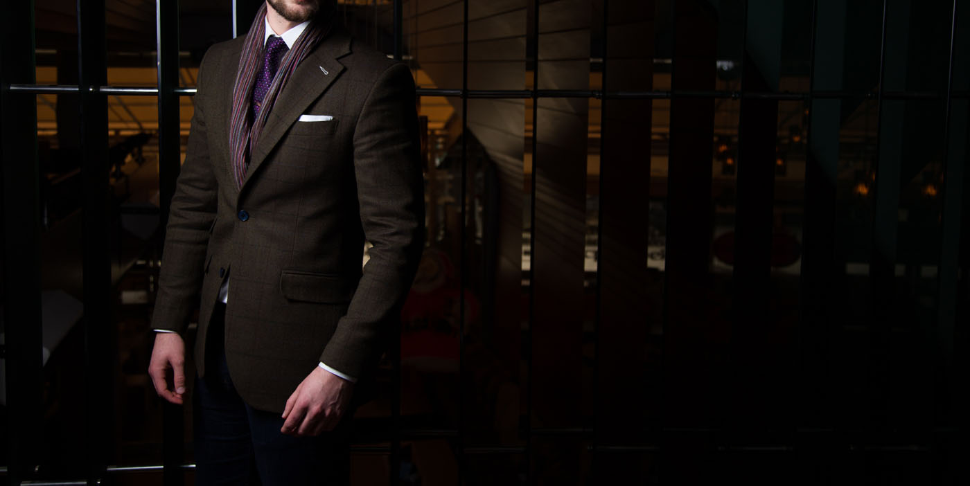 A person wearing custom clothing from Pearce Bespoke, a professional suit tailor.