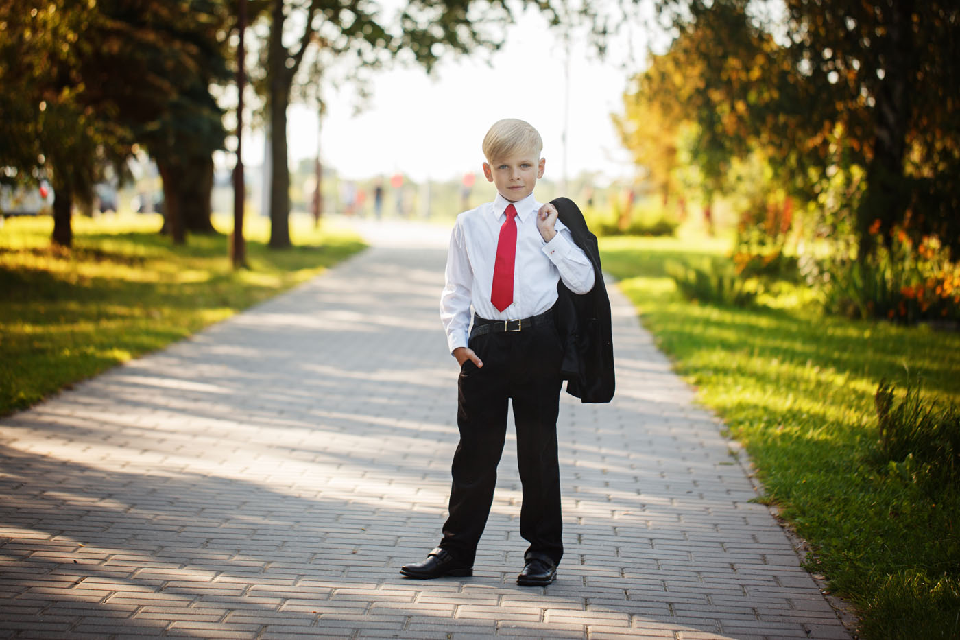 A boy wearing one of Pearce Bespoke's custom teenage suits.