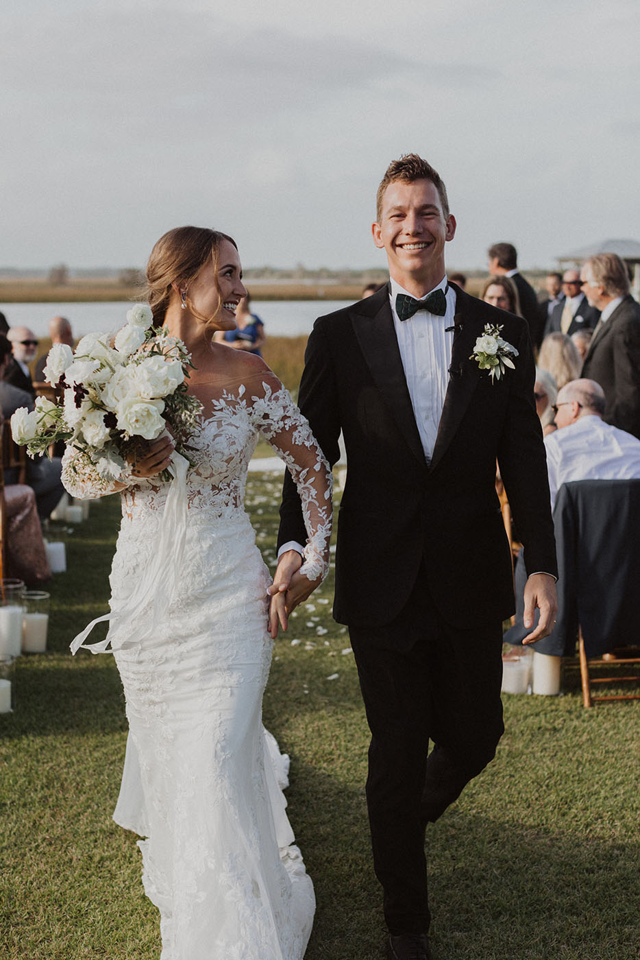 A bride and groom walking down the isle in your local area, {fran_state_abbrev}.