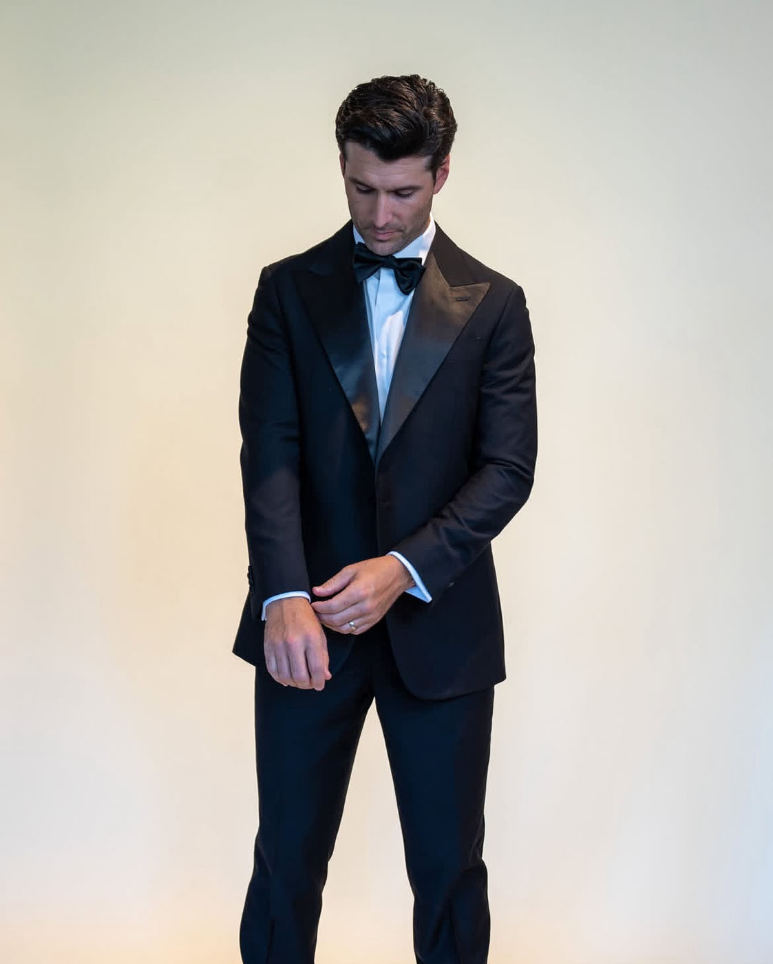 A man wearing a custom wedding suit from Pearce Bespoke.
